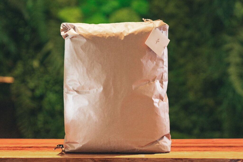 Bag of human composting soil sitting on counter in lobby of green funeral home