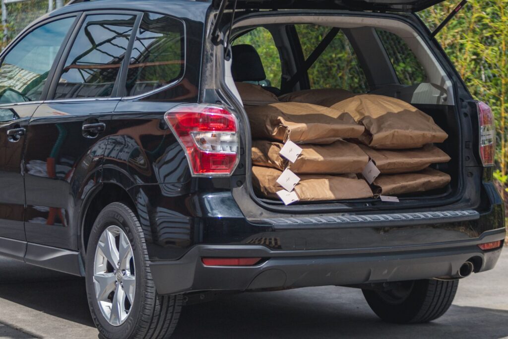 car with bags of human composting soil