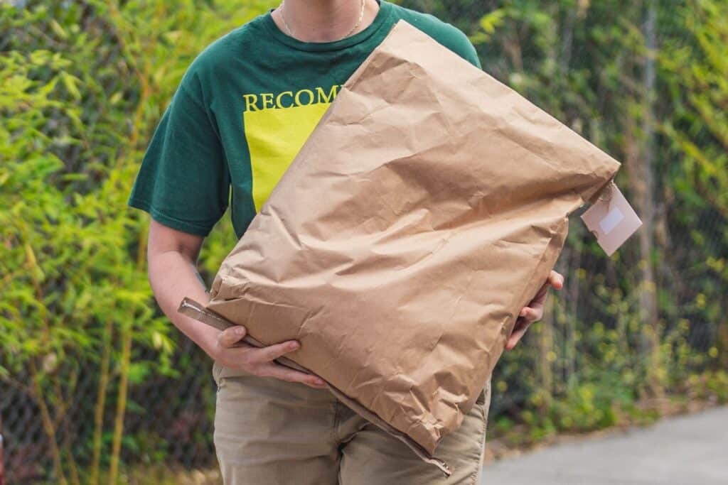 pPerson Carrying Bag of Human Composting Soil