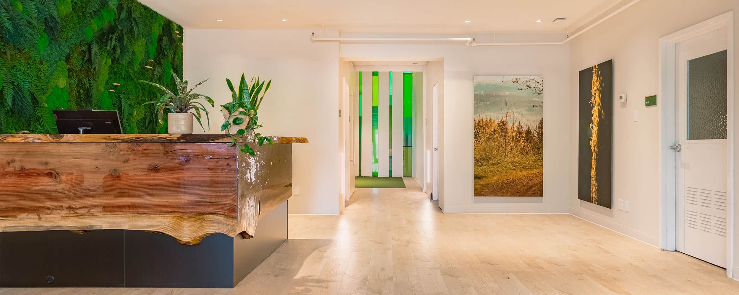 reception area of funeral home with green wall and desk