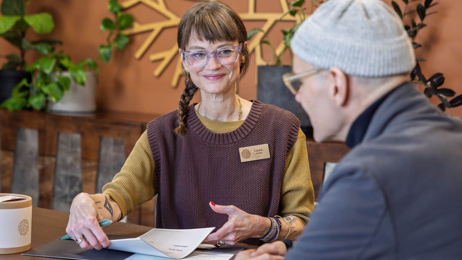 smiling funeral director talking to client
