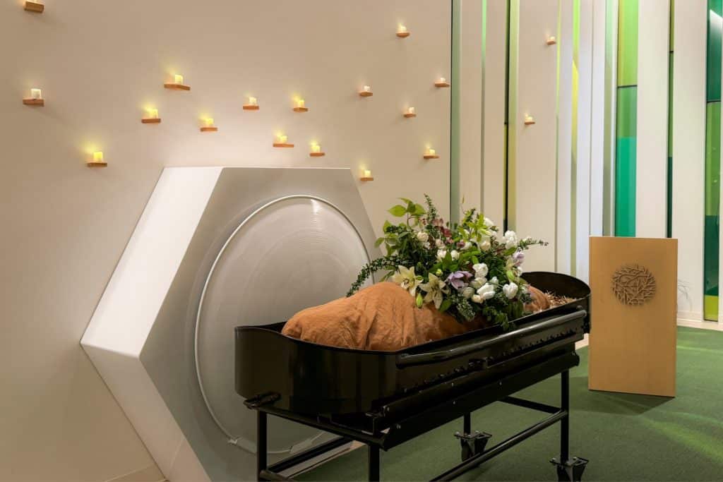 shrouded mannequin in front of threshold vessel