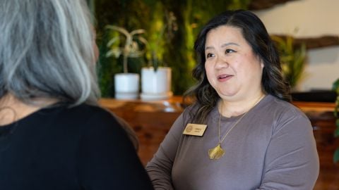 Staff at funeral home talking to client
