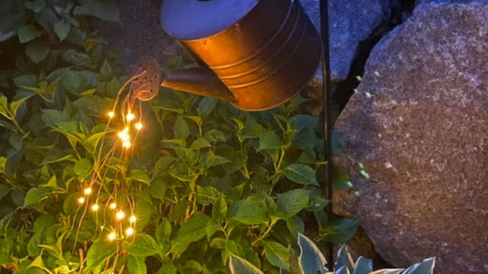 lights coming out of pot in garden