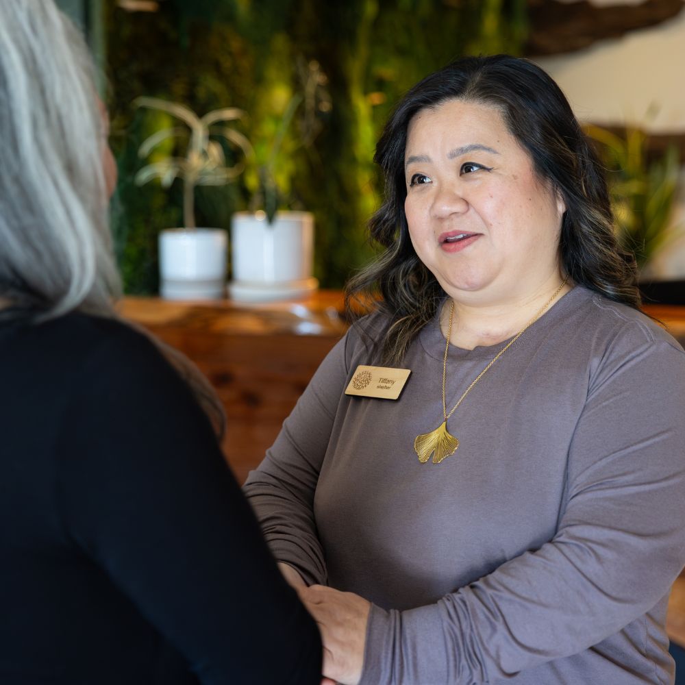 Funeral director talking to client funeral director talking to person