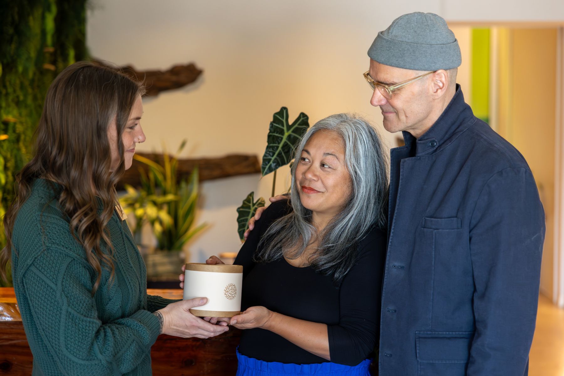 two funeral planners talking to staff at funeral home