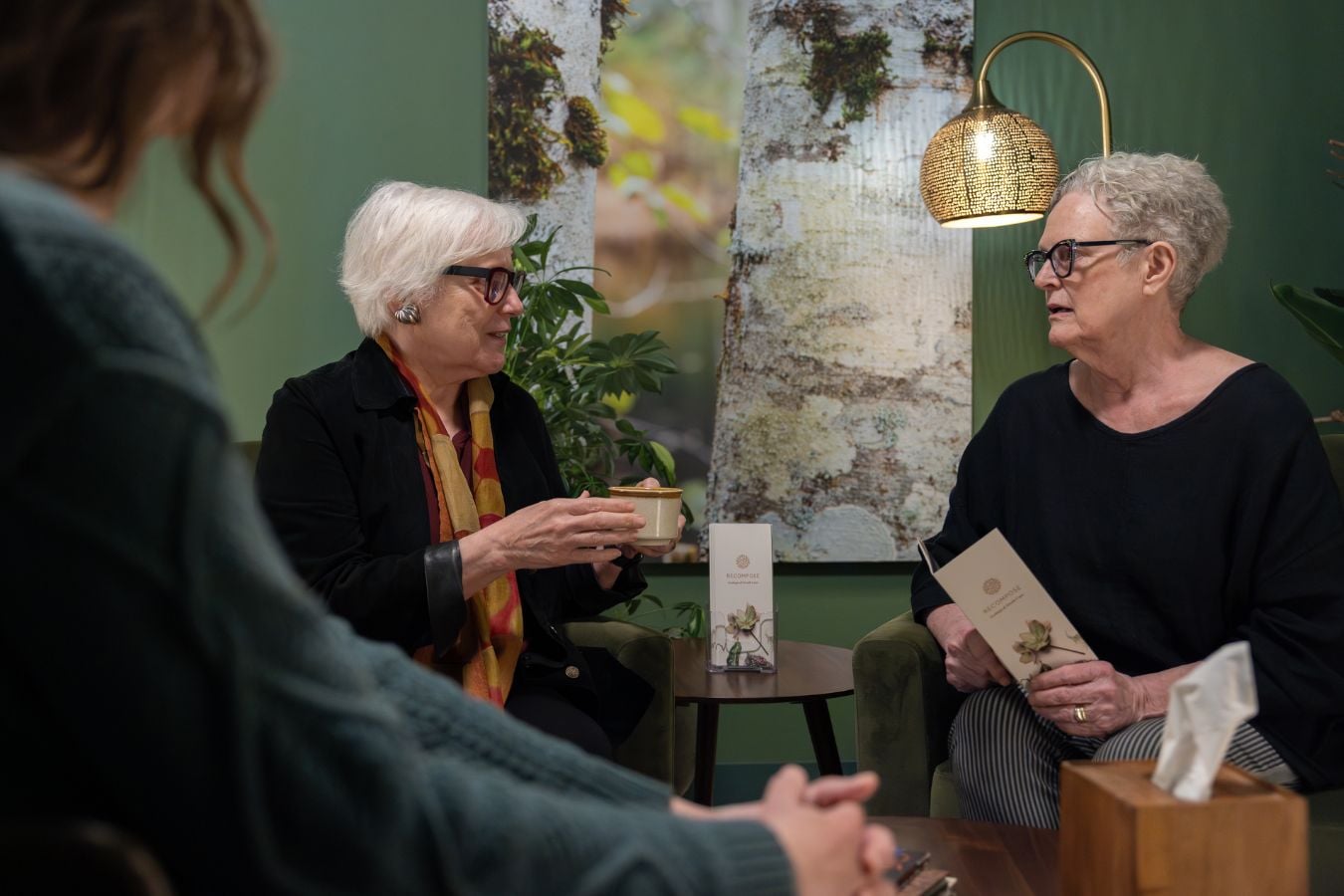 two women in a cozy room talking