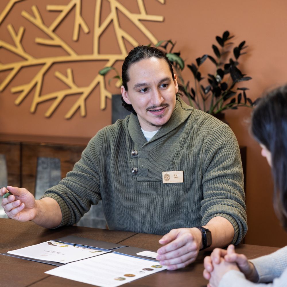funeral home agent talking to client